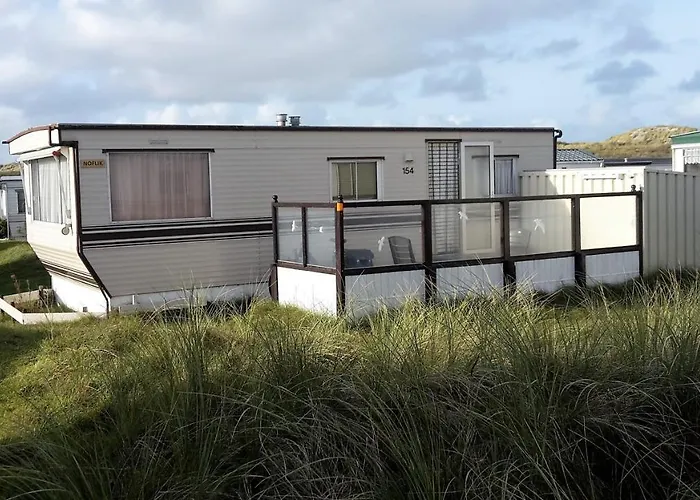 AMELAND-Nes-Duinoord: Stacaravan (chalet) + fietsen direct aan zee!